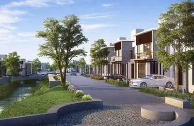 Tree-lined internal street beside a water body at Vaarivana