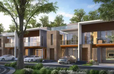 Villa facades with covered parking along a landscaped avenue