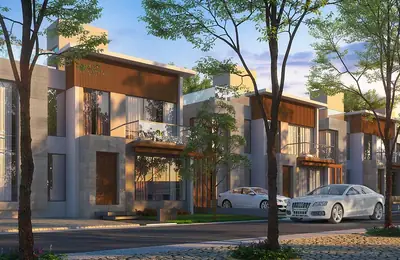 Villas at golden hour with mature trees in the foreground