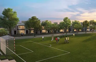 Football ground inside the estate with villas along the edge